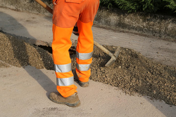 man at work with orange pants in the site