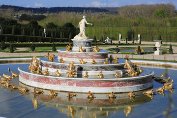 the fountain with sculptures in the Park of Versailles
