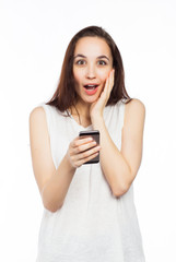 Fototapeta premium Surprised woman using a smartphone