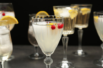 Different refreshing cocktails on table