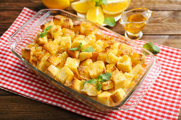 Delicious bread pudding with raisins in glass dish