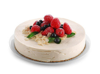 Delicious cheesecake with berries on white background
