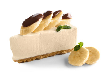 Delicious cheesecake slice with chocolate and bananas on white background