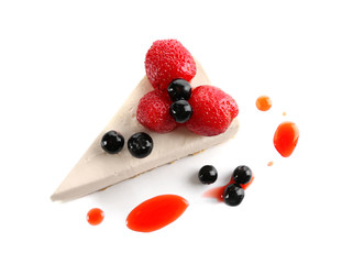 Delicious cheesecake slice with berries on white background