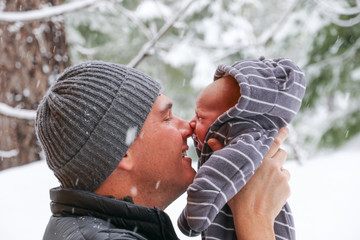 People: Father with newborn in snow