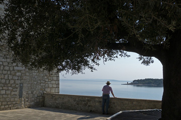 A man enyoing the view of Rab Croatia