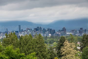 Fototapeta na wymiar Vancouver Under Storm Clouds From Hills