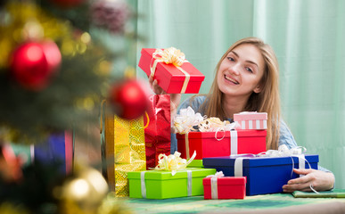 Fototapeta na wymiar Happy girl with Christmas gifts and presents