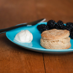 Fresh Baked Scone With Cream and Berry Jam