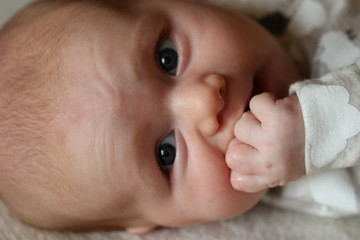 People: Baby sucking fingers