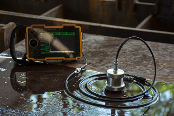 Ultrasonic test to detect imperfection or defect of steel plate in Workshop, NDT Inspection.