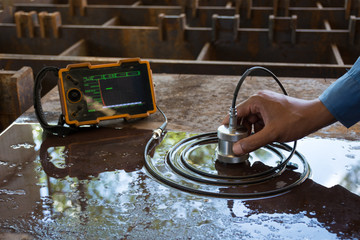 Ultrasonic test to detect imperfection or defect of steel plate in Workshop, NDT Inspection.