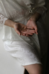 Wedding rings in the hands of the bride