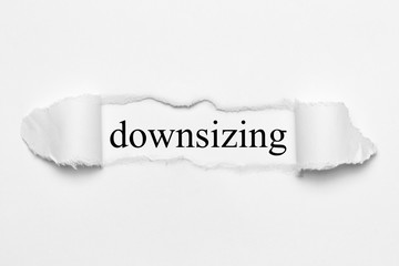 downsizing on white torn paper 