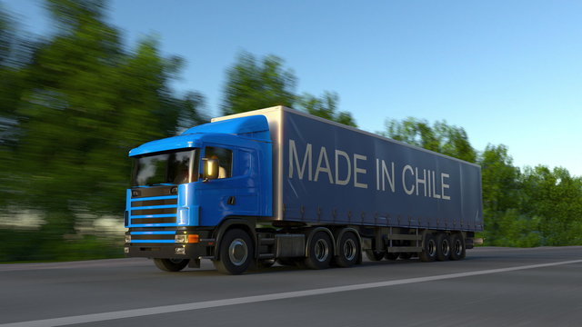 Speeding freight semi truck with MADE IN CHILE caption on the trailer. Road cargo transportation. 3D rendering