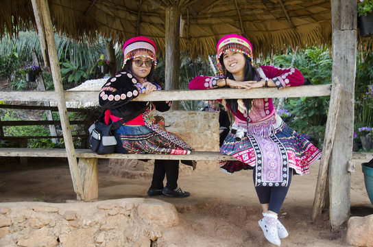 Thai mother and daughter wearing costume traditional of ethnic hmong for take photo in garden and visit Doi Pui Tribal Village and National Park
