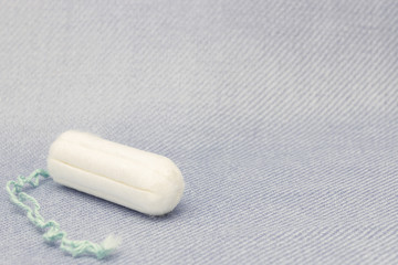 Menstruation cotton tampon for woman hygiene protection. Soft tender protection for woman critical days, gynecological menstruation cycle