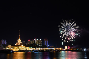 Festive fireworks over a city at night