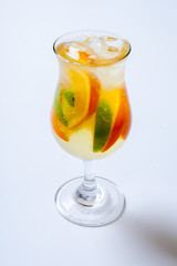alcoholic cocktail with rum liqueur orange lime and tequila. White background