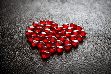 Plastic red hearts in shape of heart. Love concept