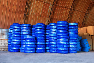 pvc Plastic pipes stacked in a warehouse yard use plumbing or sewage installations on construction site, packed for shipping