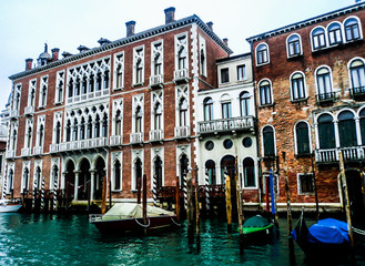 Fototapeta na wymiar Facades of historical houses and gondolas on the Grand Canal. Venice, Italy