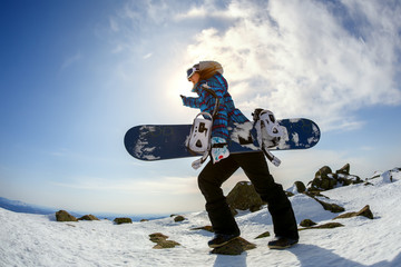 Girl snowboarder enjoys the ski resort