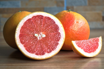 Closeup of red grapefruits on a wooden table