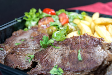 juicy steak beef meat with tomato and french fries
