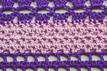 Colorful knitted background. Closeup of crochet blanket
