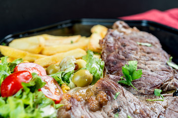 juicy steak beef meat with tomato and french fries