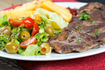 juicy steak beef meat with tomato and french fries