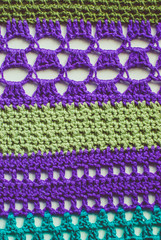 Colorful knitted background. Closeup of crochet blanket