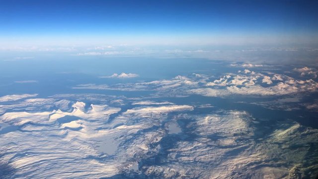 Aerial view over the snowy mountains of Northern Norway