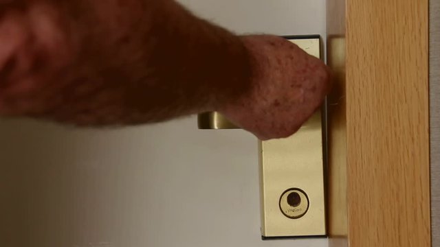 Man Opens Door in Hotel Room With the Help of a Magnetic Card
