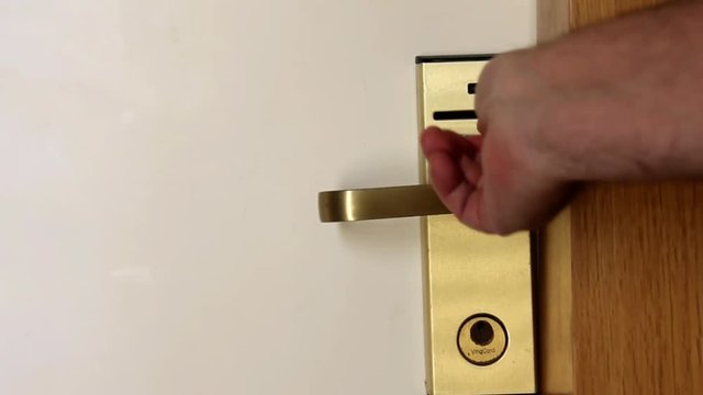 Man Opens Door in Hotel Room With the Help of a Magnetic Card