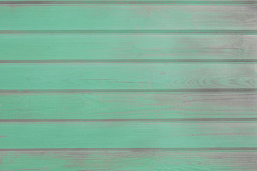 Turquoise old wooden fence. wood palisade background. planks texture