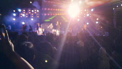 Fototapeta na wymiar Silhouettes of concert crowd