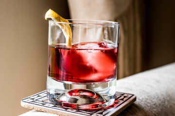 Negroni Cocktail with lemon peel and ice