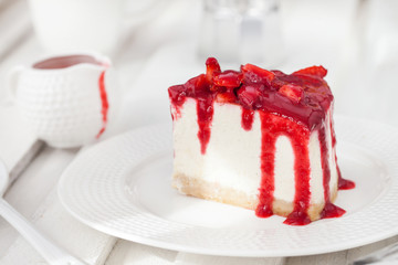 Delicious cheesecake decorated with berry sauce
