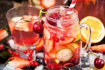 Healthy infused detox water with fresh berries and fruits