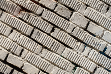 Fragment of dirty vintage grunge brick wall obliquelly. Horizontal texture. For abstract light background, pattern, wallpaper or banner design, place for your text