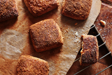 Top view of homemade cinnamon biscuits on baking paper. 