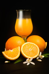Orange, orange juice on rustic wood background