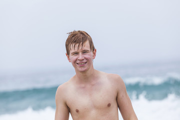 Fototapeta na wymiar young boy at the beach