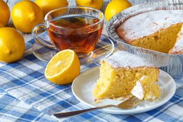 Lemon yogurt loaf cake, sliced on plate