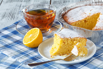 Coconut citrus syrup cake served on plate