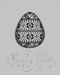 The Easter egg with an ethnic ornament. Isolated vector egg embossed on a paper. With a elegant silver typography.