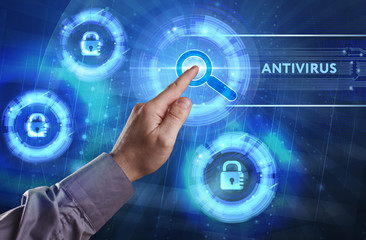 Business, Technology, Internet and network concept. Young businessman working on a virtual screen of the future and sees the inscription: Antivirus