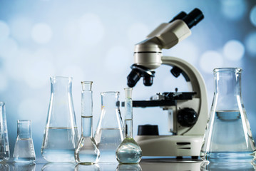 Science Concept. microscope with lab glassware, laboratory research and development 